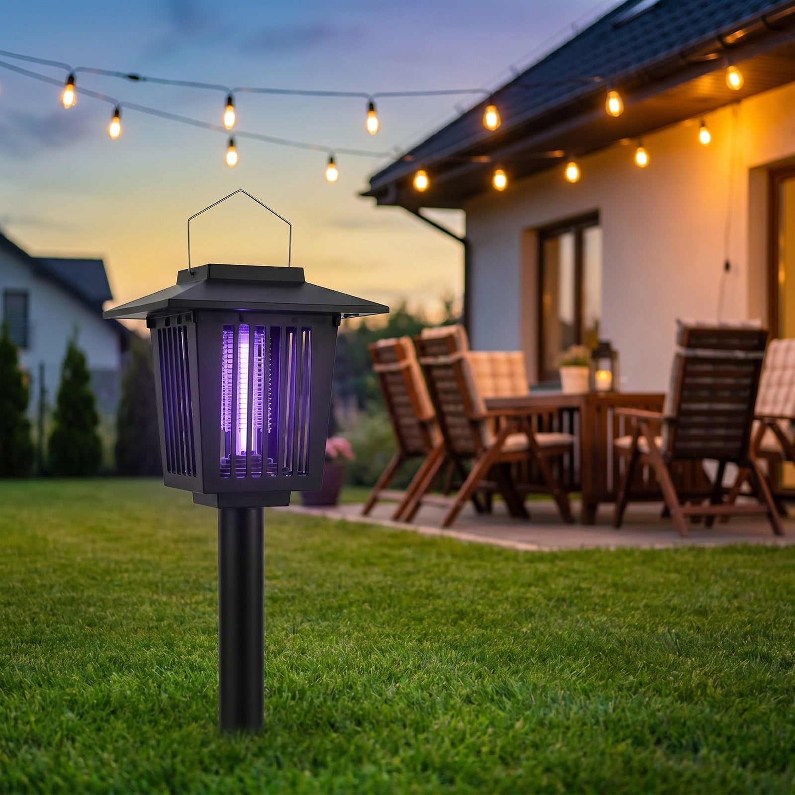 Zaedos BugZap staked in a lawn at dusk, glowing and protecting a patio